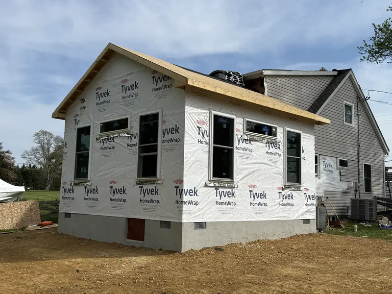 Weather-wrapped home addition with windows