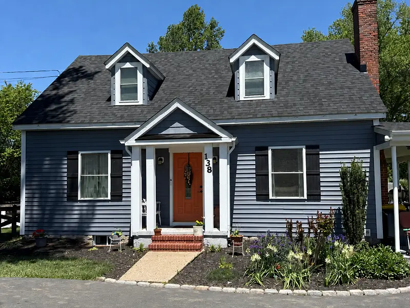 Completed dark blue Cape-style home
