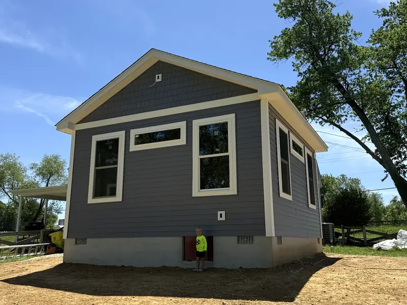 Completed compact gray home addition