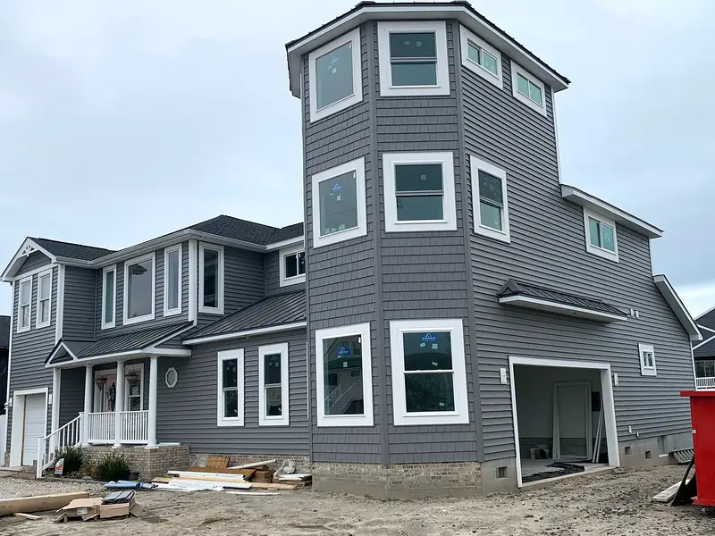 Large gray tower addition exterior